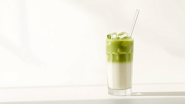 Iced NeuroMatcha latte in a tall glass, layered green matcha over milk